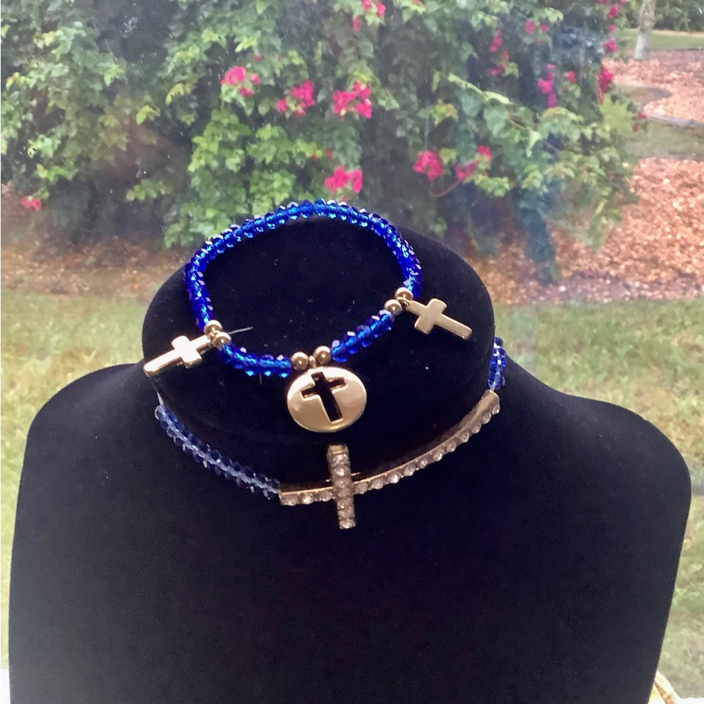 Beaded bracelets with crosses stretchy. In excellent condition. Made of …